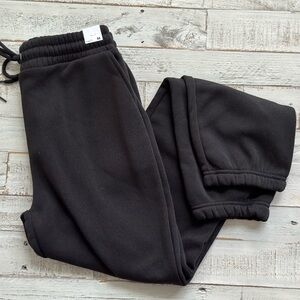 Black jogger with drawstring and pockets. NWT